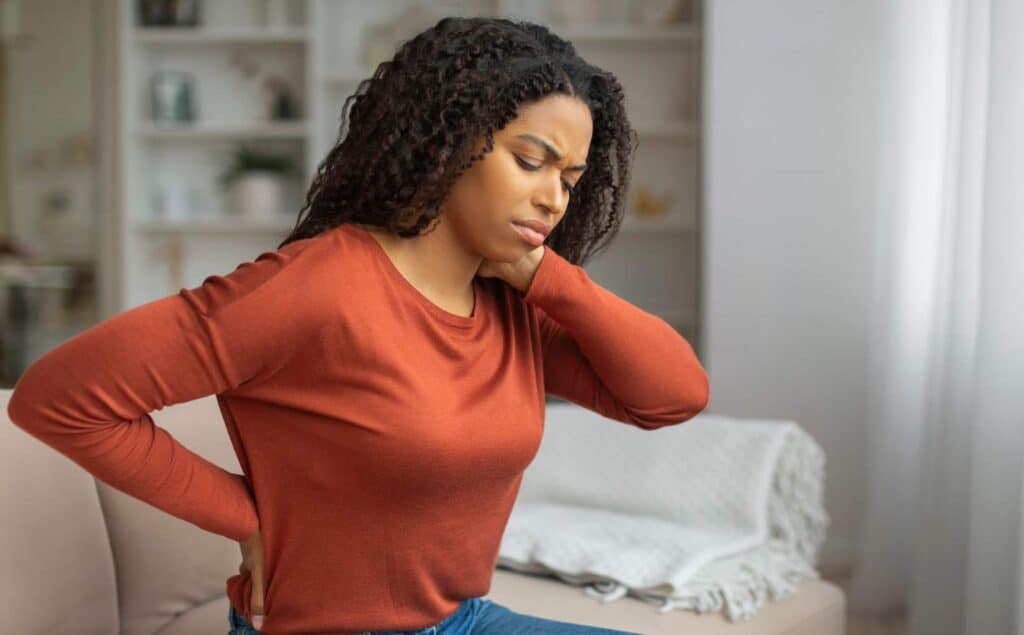 Woman experiencing chronic pain symptoms.