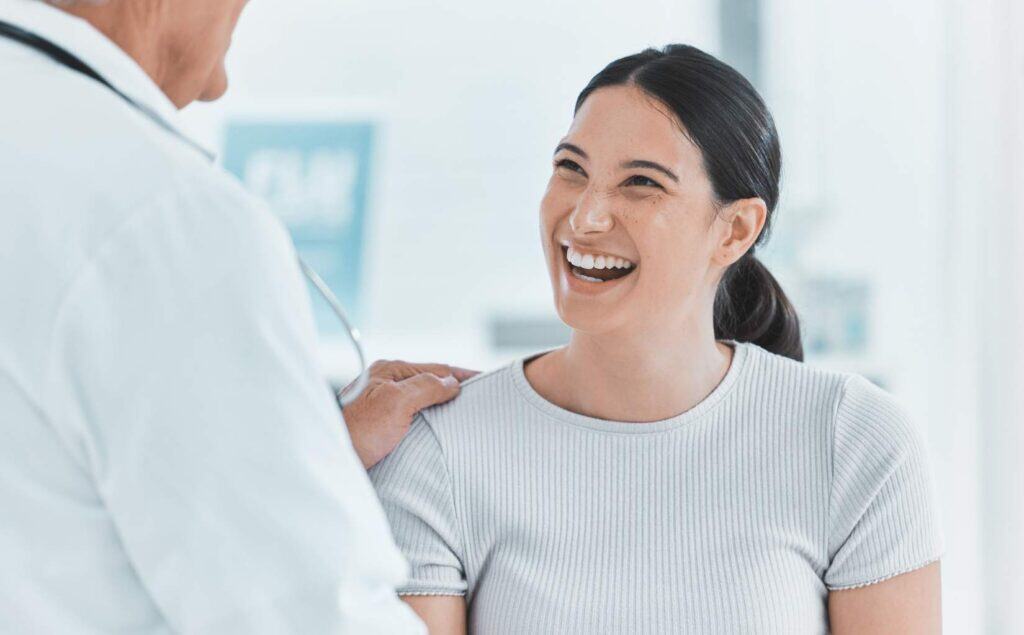 Woman discussing mild TMS side effects with a provider.